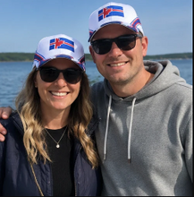 Load image into Gallery viewer, People wearing Vestur Íslendingur heritage caps by the water